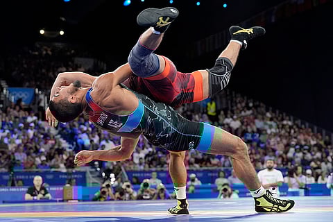 Kyrgyzstan's Amantur Ismailov and Azerbaijan's Hasrat Jafarov compete in men's Greco-Roman 67kg bronze medal wrestling